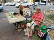 Patrice Draper welcomed community members while Penny Bristol-Jones helped out on the dog minding front.